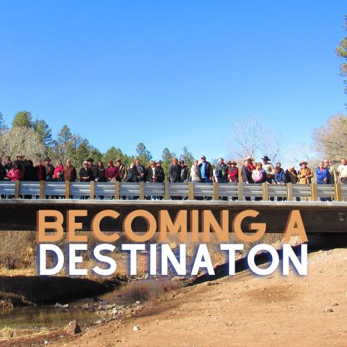An illustration with people standing on the bridge at Clifton, Arizona to demonstrate growth and interest in developing local tourism